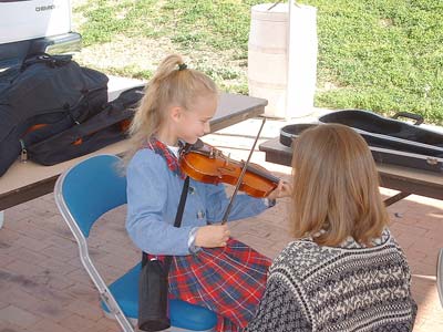 Moriah playing violin at the 2005 Family Arts Festival